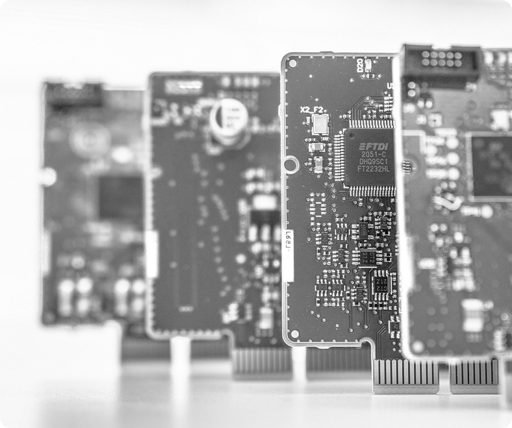 Four Atomik test instruments commonly used for functional circuit testing (FCT) in electronics production.